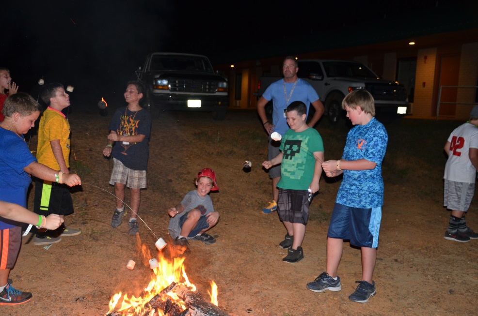 Campers around a camp fire.