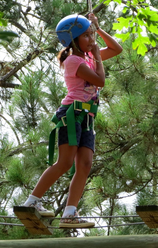 Girl on high ropes.